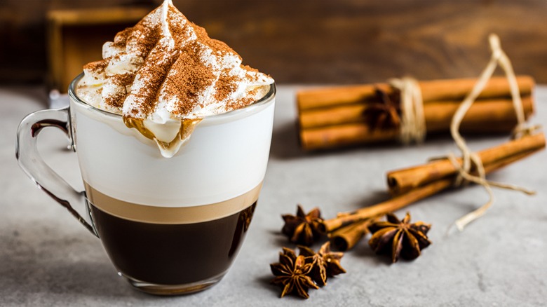 Green chaud with anise and cinnamon in background