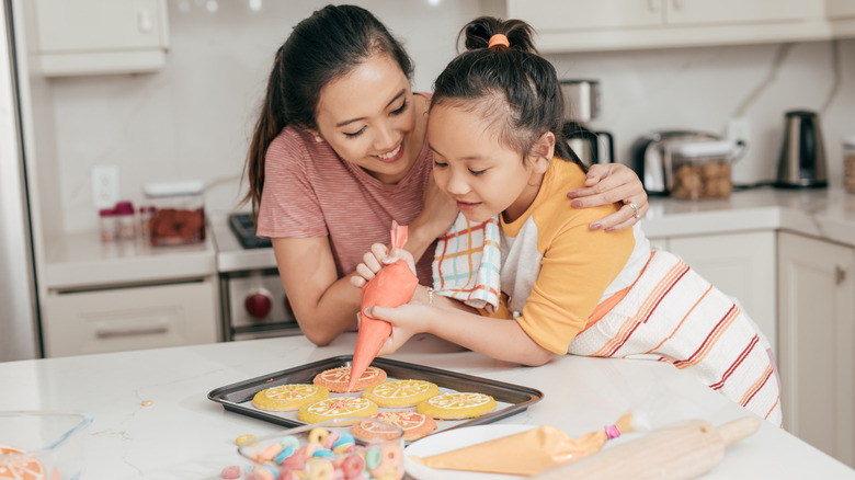 Family decorating sugar cookies