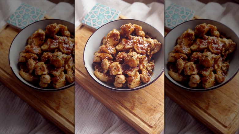 Bowl of Orange Chicken on table