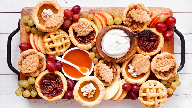 Platter with various fall-themed pies