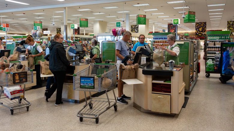 Customers check out at Publix