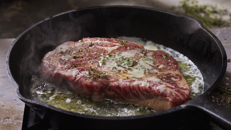 Steak and butter in a pan