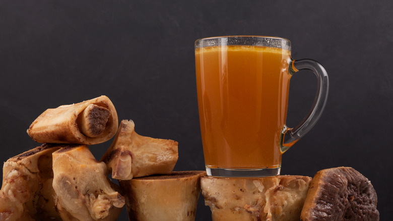 cup of bone broth on marrow bones