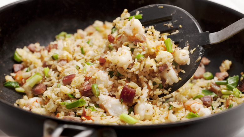 fried rice in pan, spatula