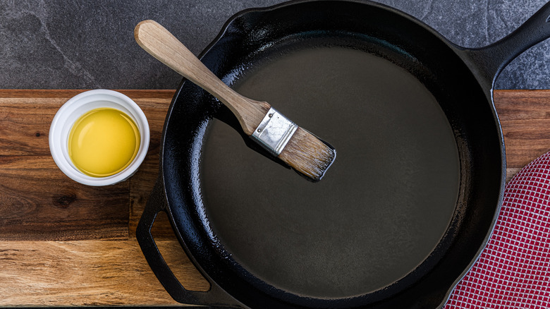 cast iron skillet coated with a layer of olive oil