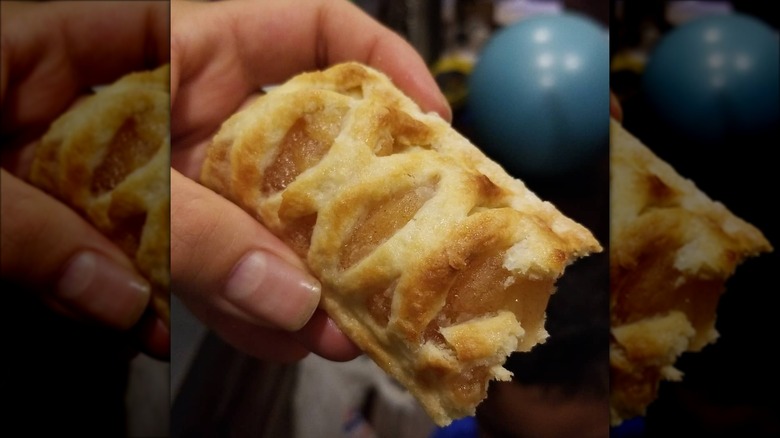 Person holding McDonald's apple pie