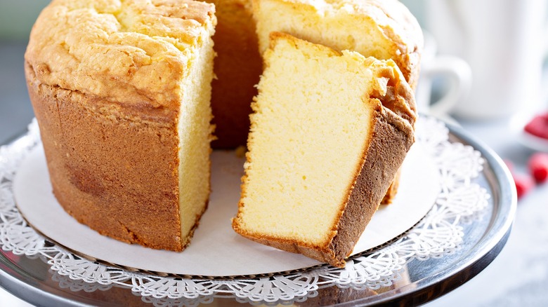 sliced angel food bundt cake sitting on cake stand