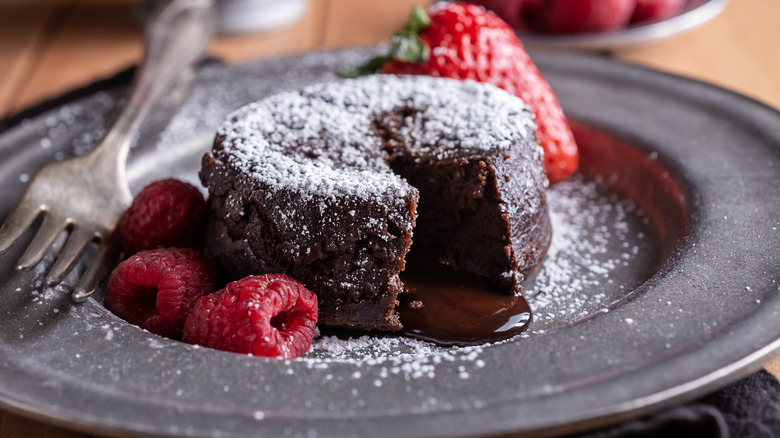 Lava cake on gray plate with fruit