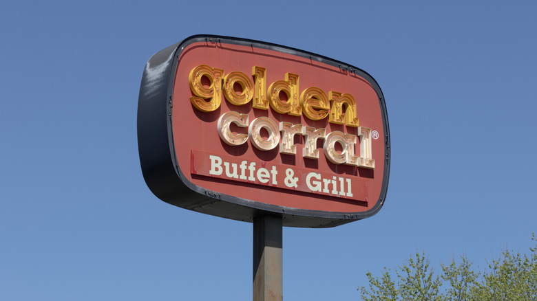 Golden Corral sign against a blue sky