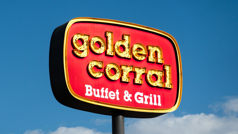 Free-standing Golden Corral sign against a blue sky