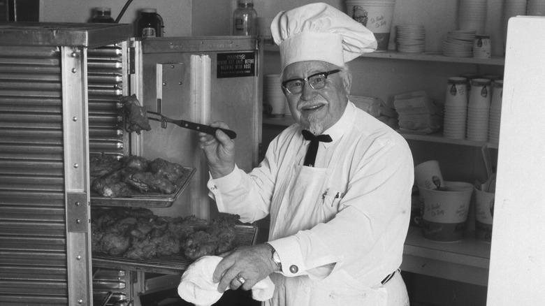 Colonel Sanders testing fried chicken