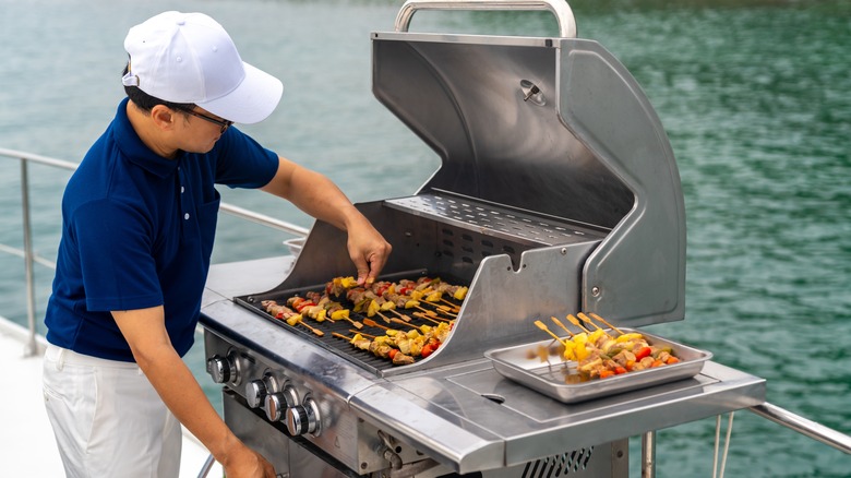 yacht chef grilling at sea