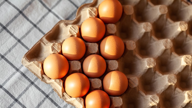 brown eggs in an egg carton