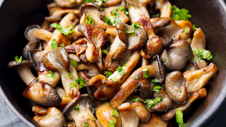 Assorted wild mushrooms in skillet