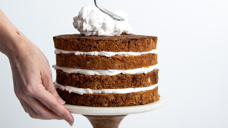 baker frosting carrot cake