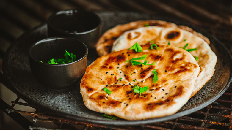 two pieces of naan bread on a plate