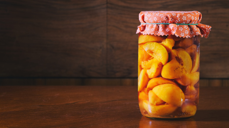 canned peaches with cloth lid