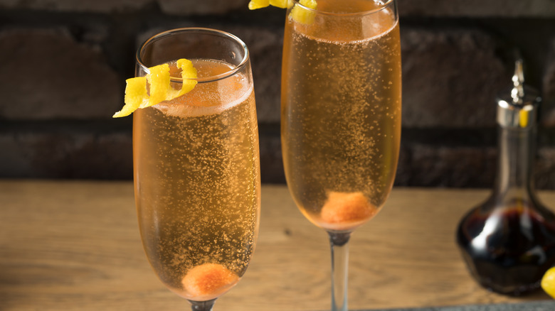 two Champagne glasses with sugar cubes