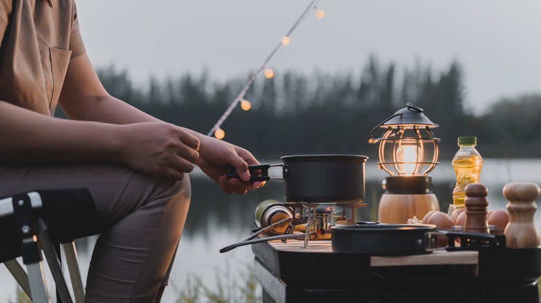 Person cooking outdoors