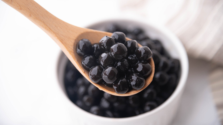 Tapioca peals on wooden spoon