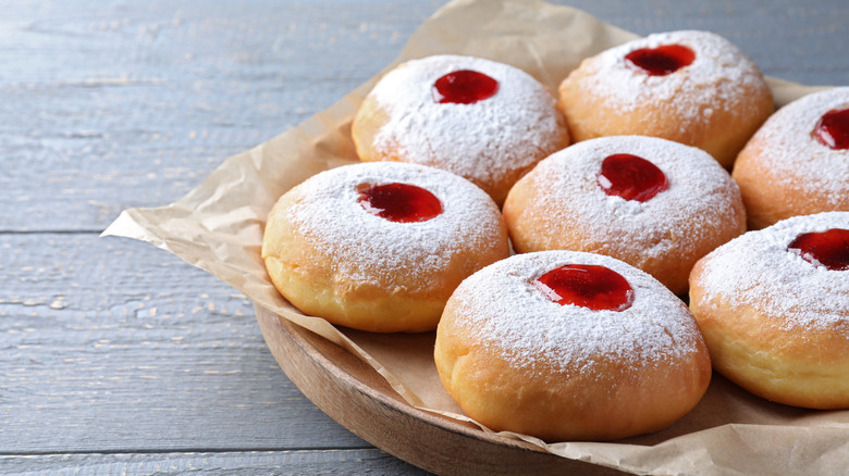 Several jelly-filled sufganiyot on tray