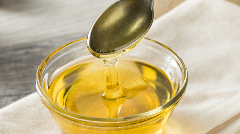 Bowl and spoonful of golden syrup