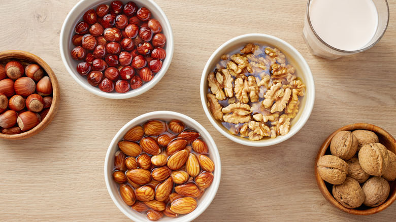 bowls of soaking nuts in liquid on table