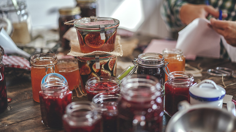 Person canning fruit in jars