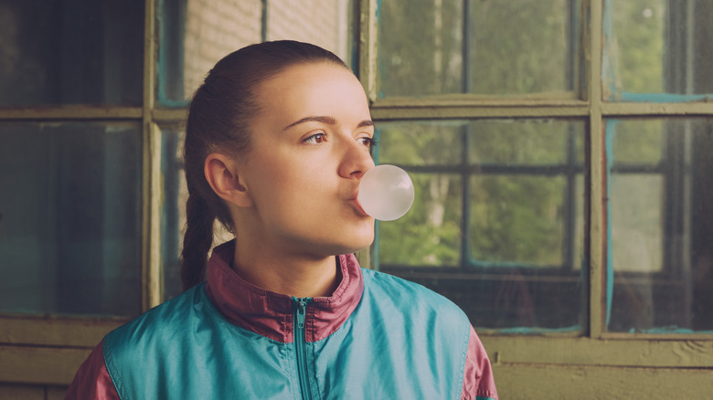 girl blowing bubble gum