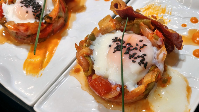 poached egg with vegetable red sauce nest