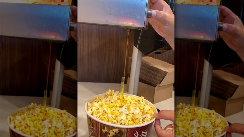 butter filling straw inserted in popcorn bucket