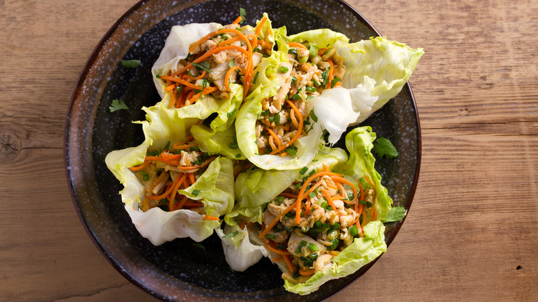 Chicken and veggie lettuce wraps black plate