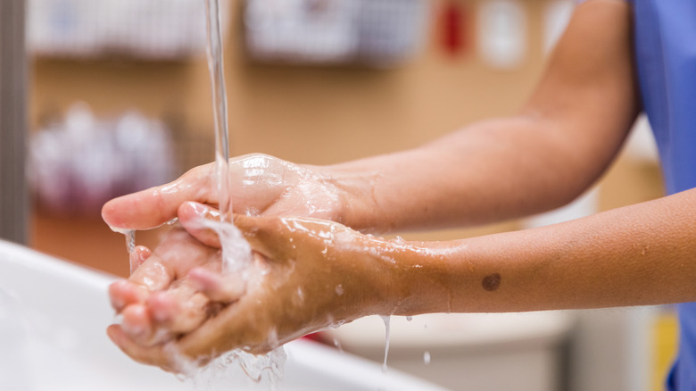 Healthcare worker washing their hands