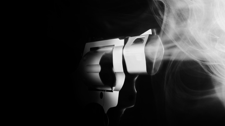 Smoking revolver in black and white