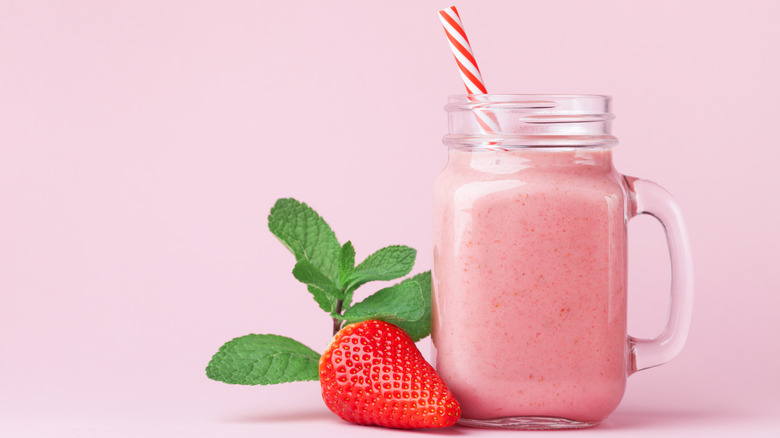 strawberry smoothie in Mason jar