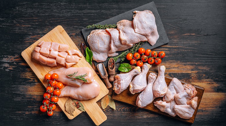 Chicken pieces on cutting boards