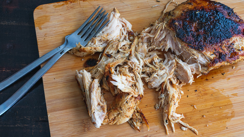 shredded chicken with forks