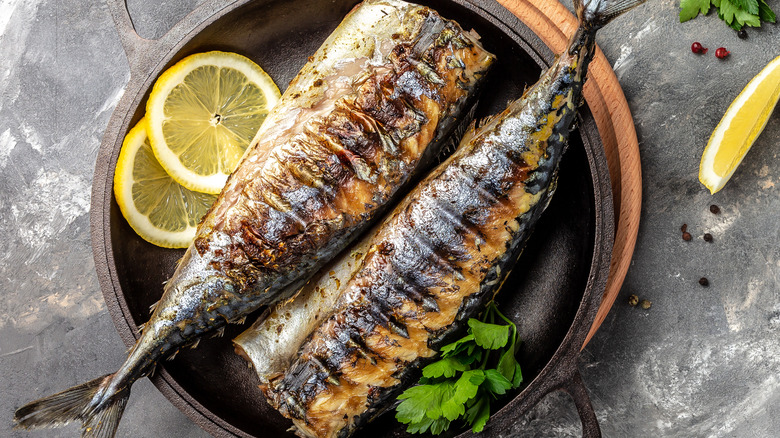 Grilled fish in cast iron pan