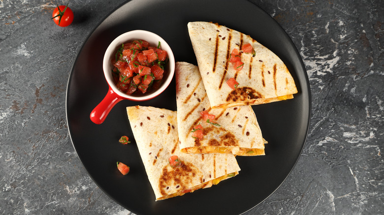 https://www.thedailymeal.com/img/gallery/the-toaster-hack-for-cheesy-quesadillas-in-a-flash/intro-1697220820.jpg