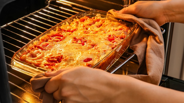 removing casserole dish from the oven