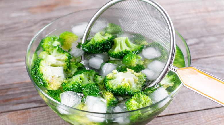 cooling blanched vegetables in an ice bath