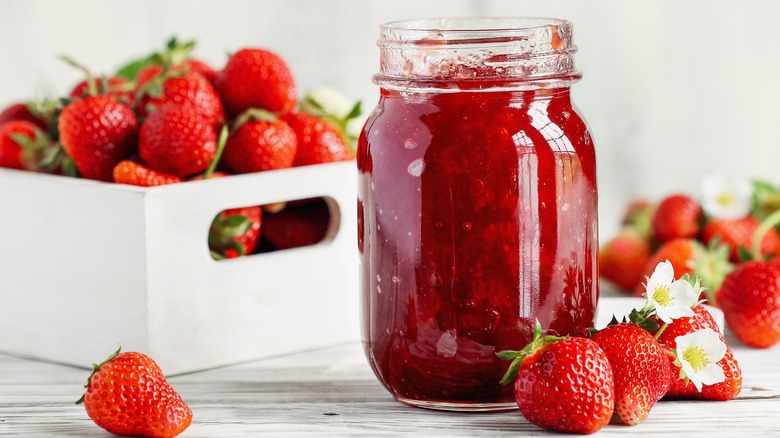 jar of strawberry jam and fresh strawberries