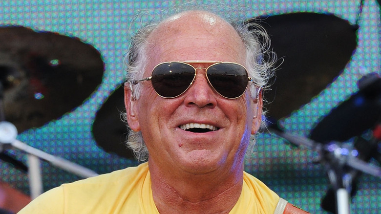 Jimmy Buffett smiling in sunglasses