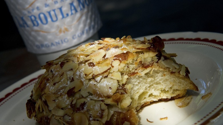 an almond pastry and a cup of La Boulange coffee