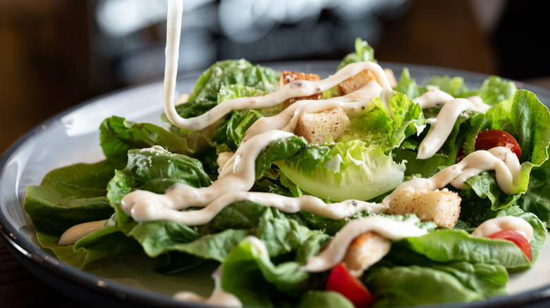 Dressing pouring on salad