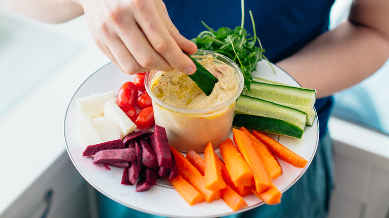 Hummus with veggies on platter