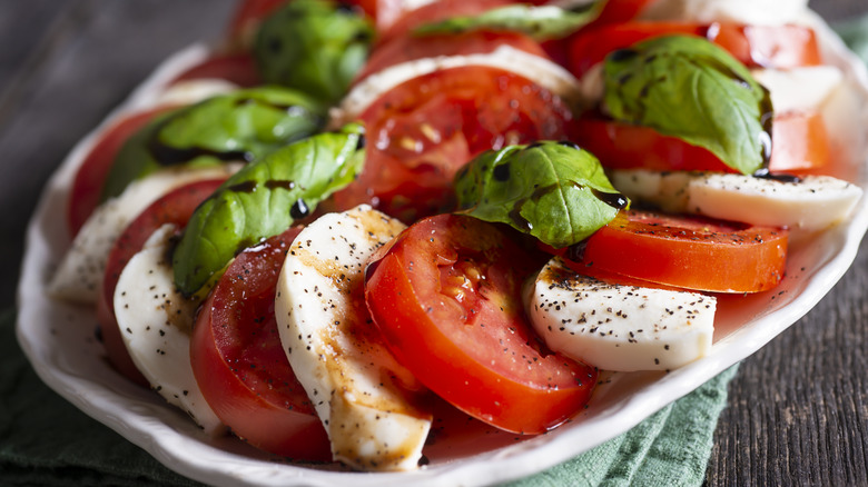 Caprese salad with tomatoes, basil, and mozzarella