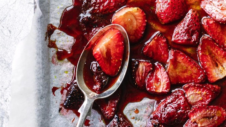 Roasted strawberries with spoon 