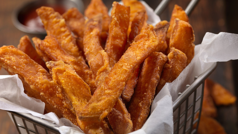 fry basket filled with sweet potato fries