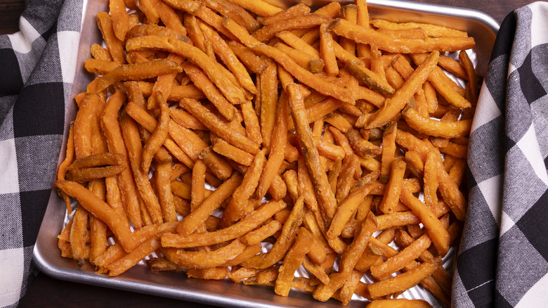 baking pan overcrowded with sweet potato fries